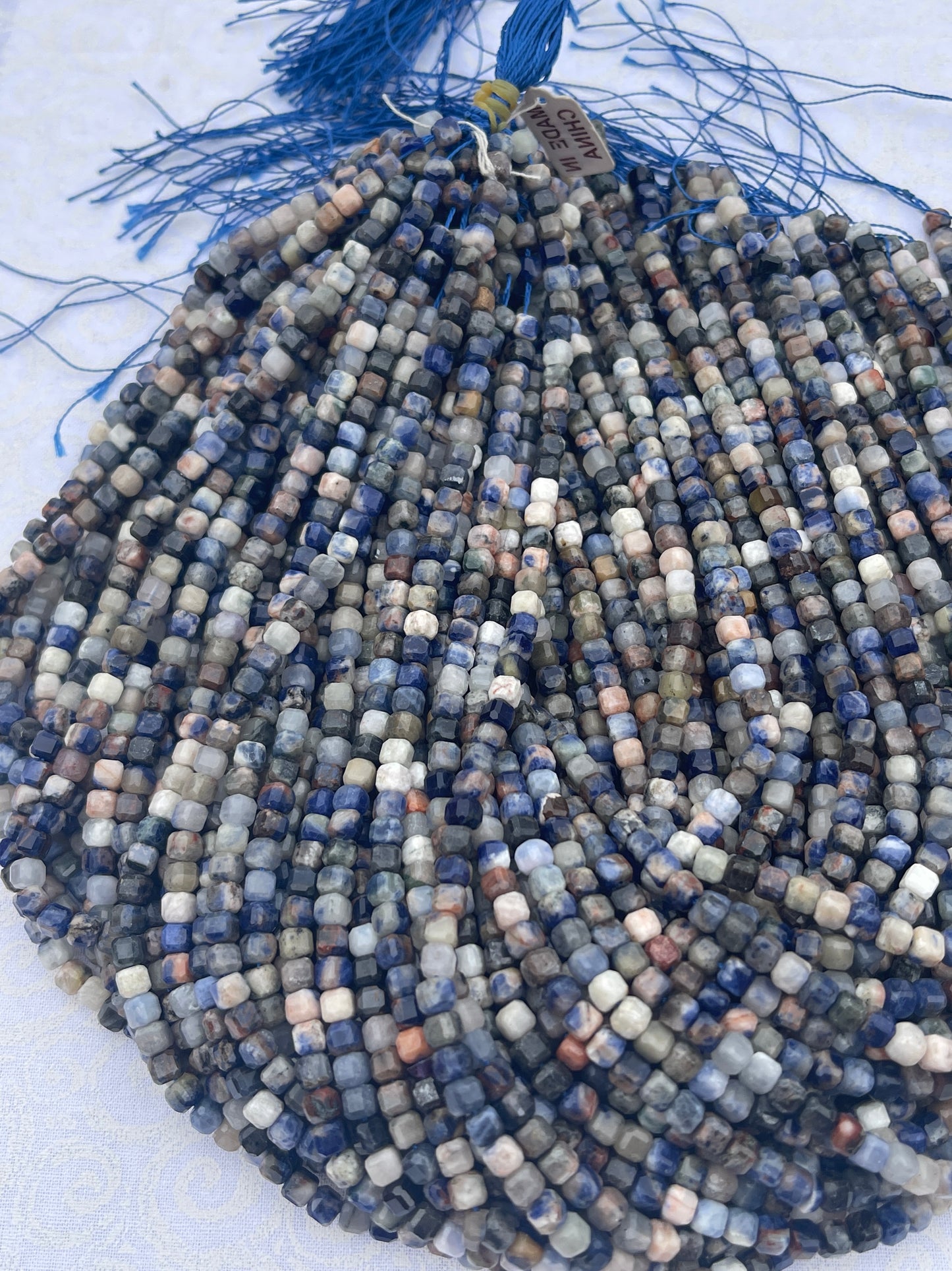 Sunset Sodalite ( 6x6mm faceted cube shape)