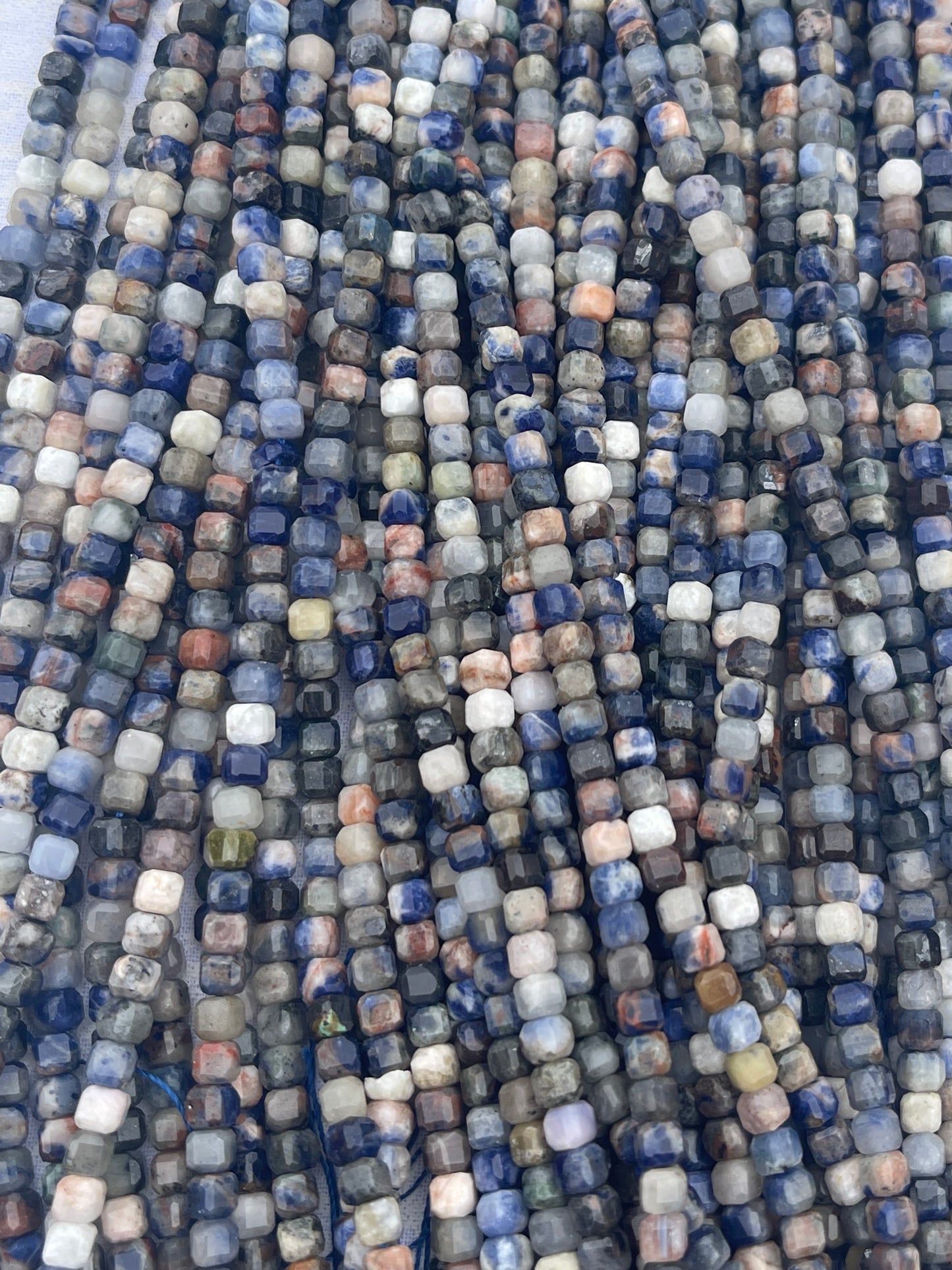 Sunset Sodalite ( 6x6mm faceted cube shape)