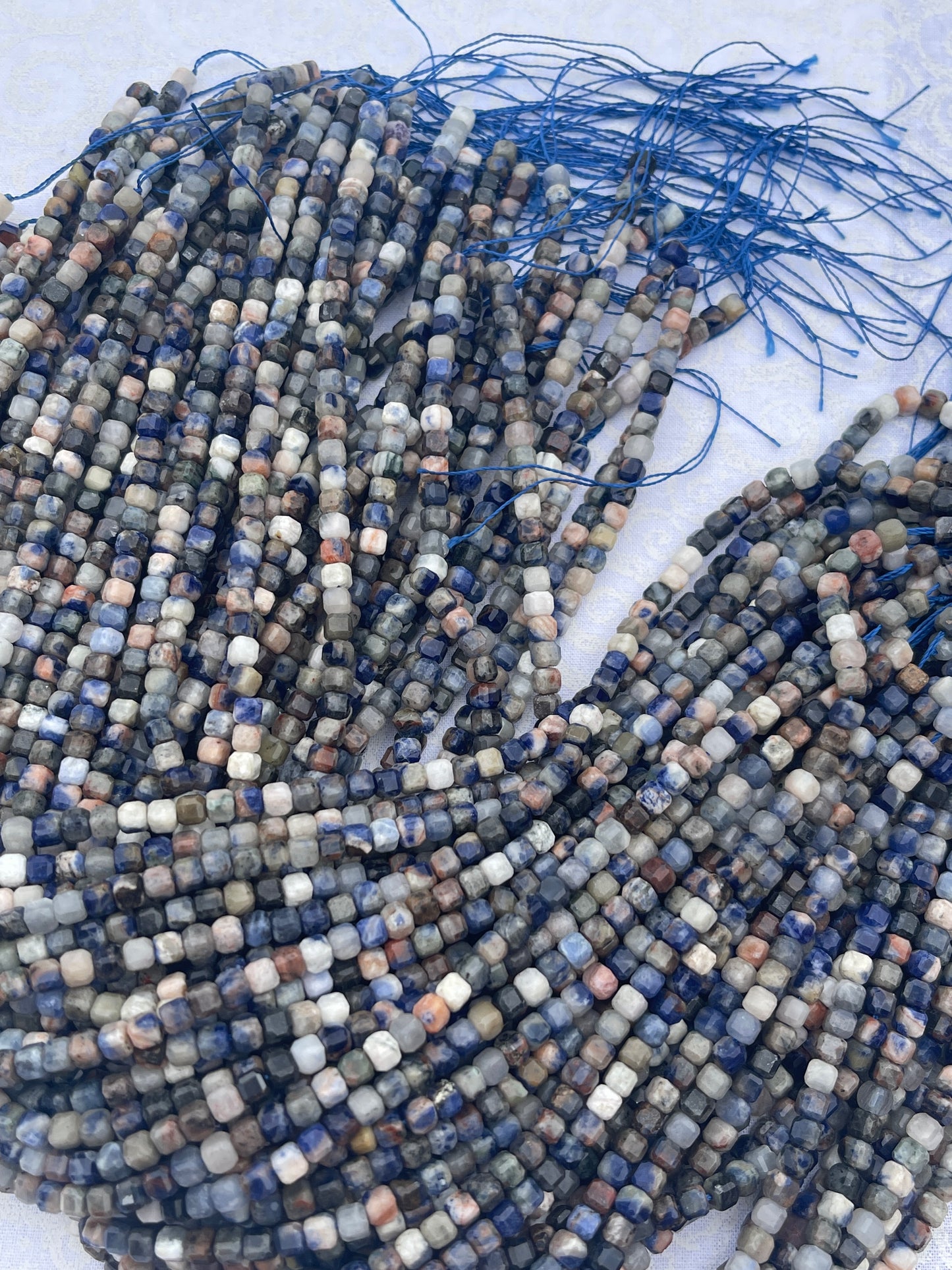 Sunset Sodalite ( 6x6mm faceted cube shape)